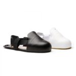 Sur-chaussure avec embout acier 200 joules et semelle anti-perforation composite noir blanc homme et femme vue de profil